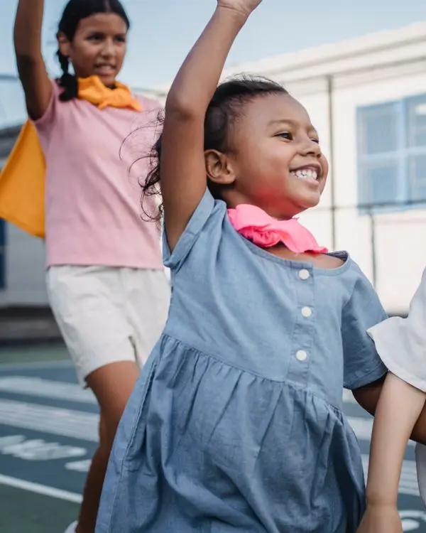 Children jumping and playing happily outdoors